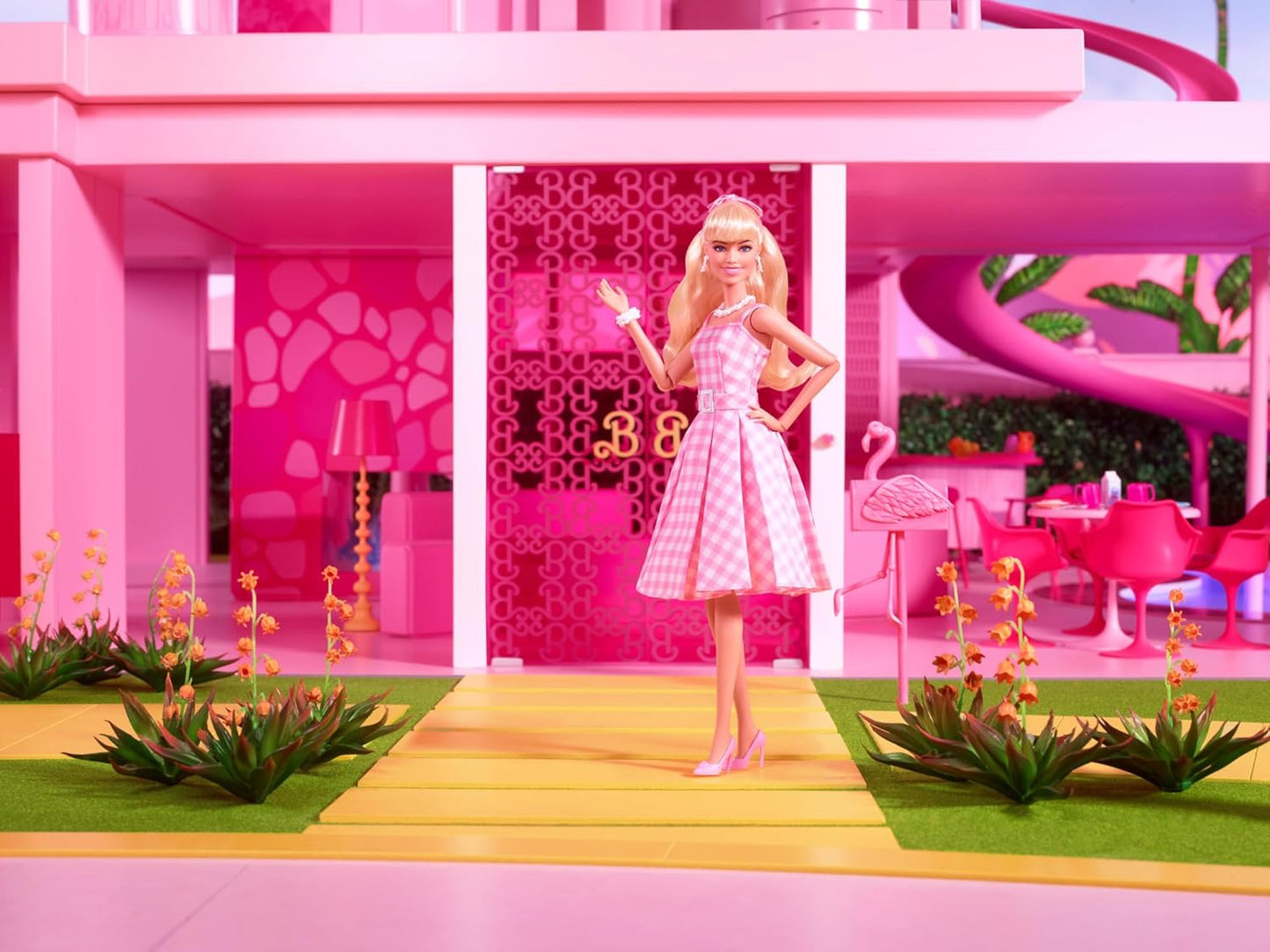 Barbie The Movie Doll Wearing Pink and White Gingham Dress with Daisy Chain Necklace.